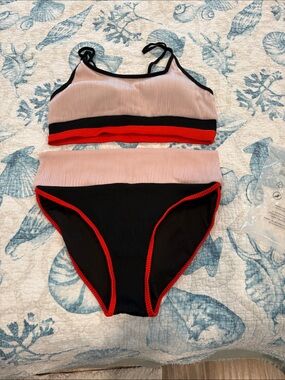 Black and orange color block two-piece swimsuit Ribbed. Fits 10-14 (new never wo